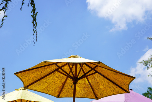 Colored umbrellas at an outdoor cafe in the tourist area of             the muria mountains  Central Java  Indonesia.
