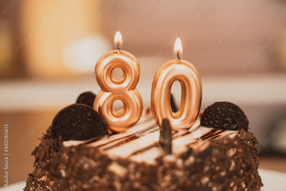 Birthday cake with candles for 80th birthday Stock Photo | Adobe Stock