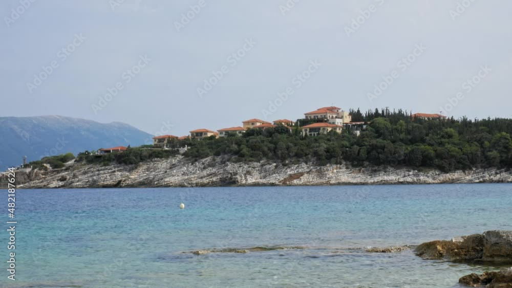 Tranquil Ocean And Beach Houses In Paralia Emplisi, Greece - static shot Tranquil Ocean And Beach Houses In Paralia Emplisi, Greece - static shot