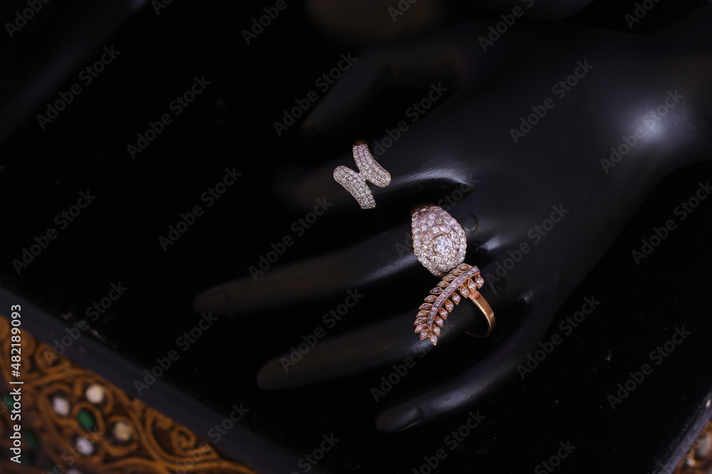 stone studded diamond ring on a hand mannequin stone studded diamond ring on a hand mannequin
