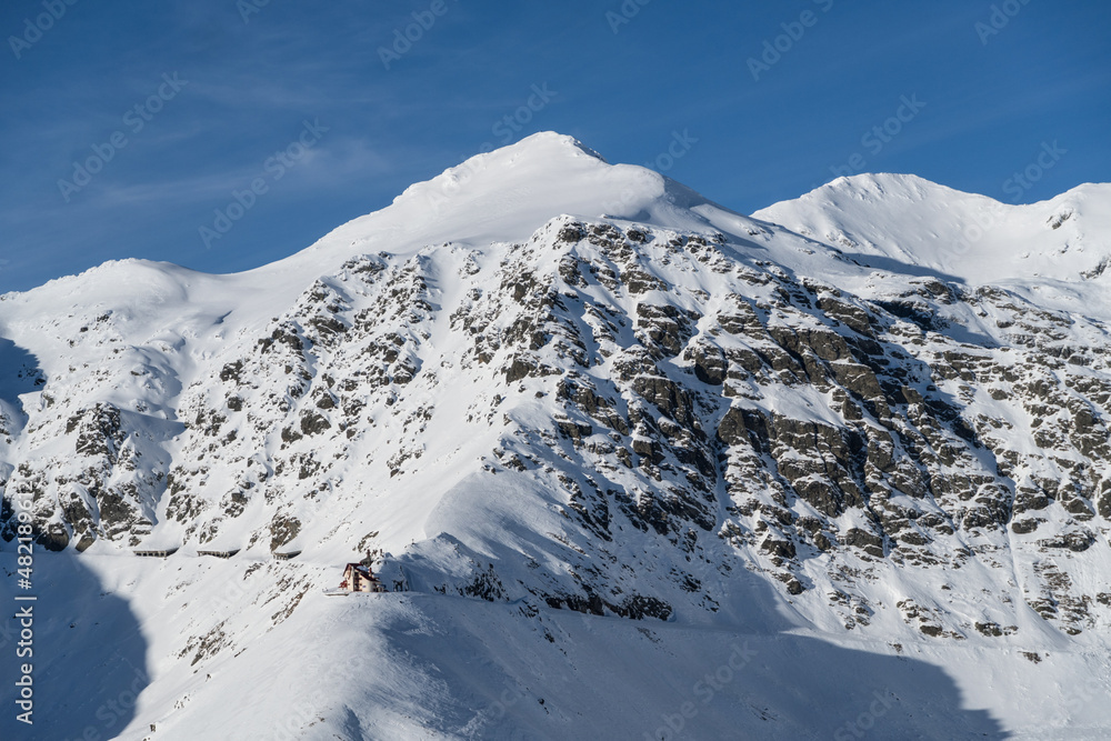 snow covered mountains, Iezerul Caprei Peak and Rescue Cota 2000, Fagaras Mountains, Romania snow covered mountains, Iezerul Caprei Peak and Rescue Cota 2000, Fagaras Mountains, Romania