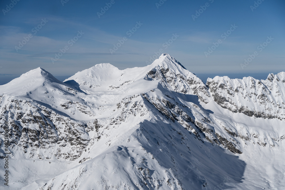 snow covered mountains, Iezerul Caprei, Vaiuga and Buteanu Peak, Fagaras Mountains, Romania 