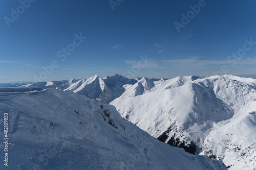 snow covered mountains, viewpoint from Museteica to Negoiu Peak, Fagaras Mountains, Romania 