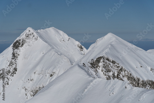 snow covered mountains, Arpasu Mic and Buda Peaks, Fagaras Mountains, Romania  photo