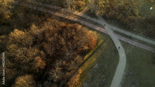 People jogging outdoor in a green park in the city of gdańsk przymorze poland. Aerial top down view photo