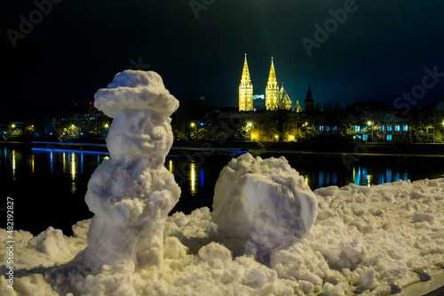 Snowmand and the river of Tisza at Szeged in winter photo