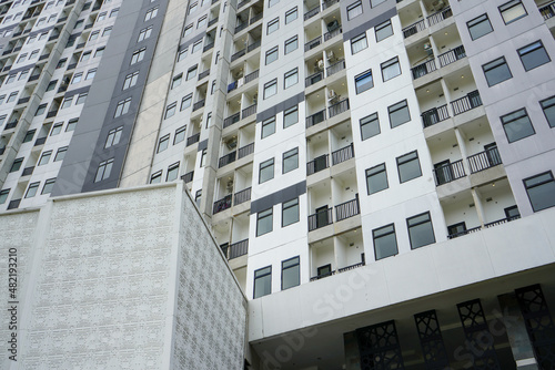 High-rise hotel or apartment buildings are a residential solution for people who live and work in big cities that are very densely populated and land is very expensive.