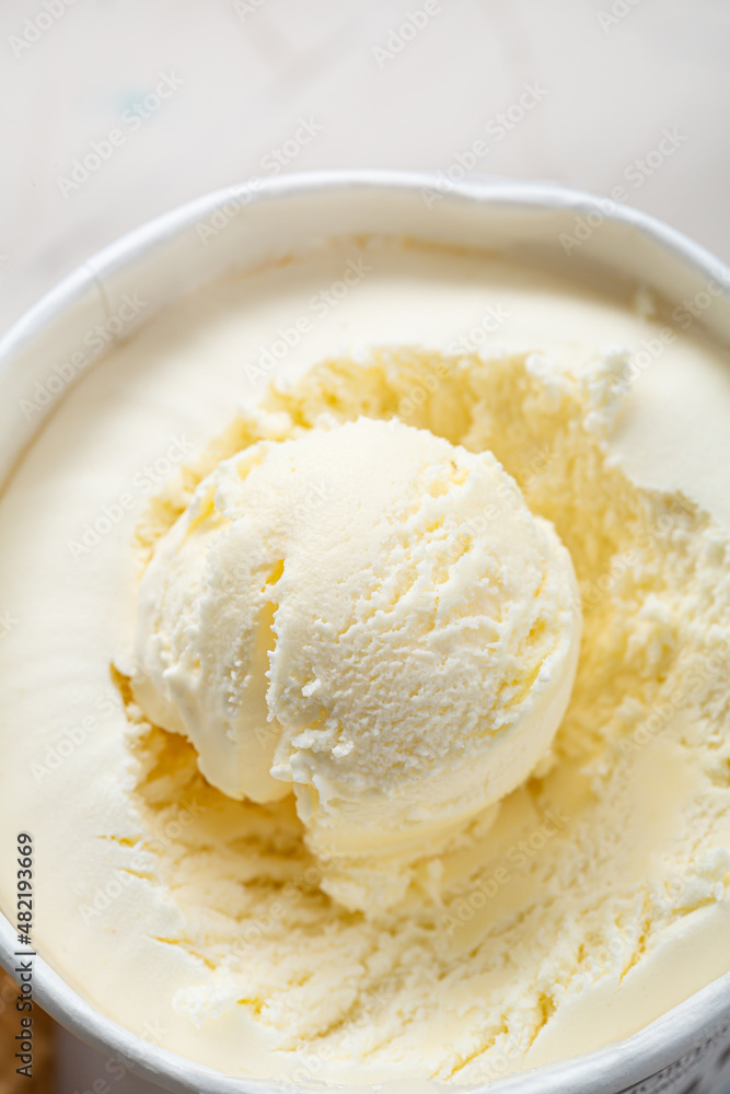 Close up of one ice cream scoop gelato in paper box Close up of one ice cream scoop gelato in paper box