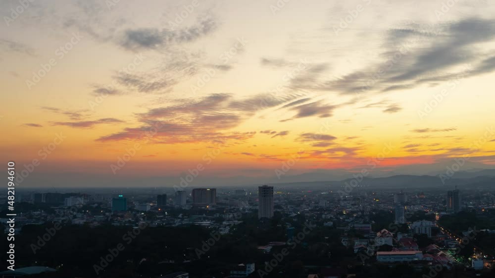 Chiang Mai, Thailand - December 9, 2021: Time lapse 4K (Zoom out shot): Aerial high angle sunset cityscape of Chiang Mai city. View of sunset and buildings at downtown area. Chiang Mai in Thailand. Chiang Mai, Thailand - December 9, 2021: Time lapse 4K (Zoom out shot): Aerial high angle sunset cityscape of Chiang Mai city. View of sunset and buildings at downtown area. Chiang Mai in Thailand.