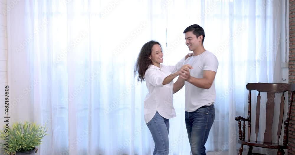 Beautiful young woman and handsome man are enjoying spending time together, Couple is dancing. Beautiful young woman and handsome man are enjoying spending time together, Couple is dancing.