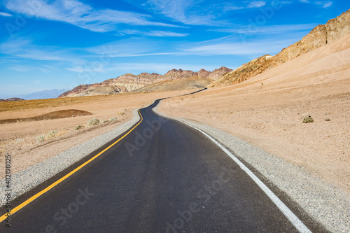 a winding road in the desert