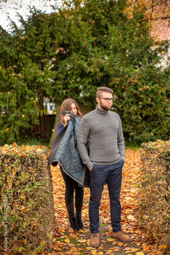 Fototapeta premium Walking white young european married couple in park