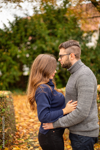 Tender young european married couple in park in fall © PIXbank