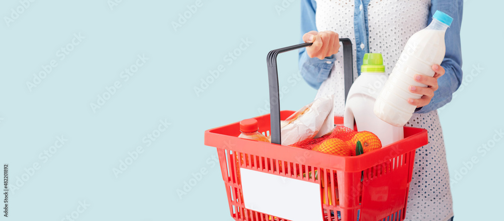 Fototapeta premium Woman doing grocery shopping and buying fresh food