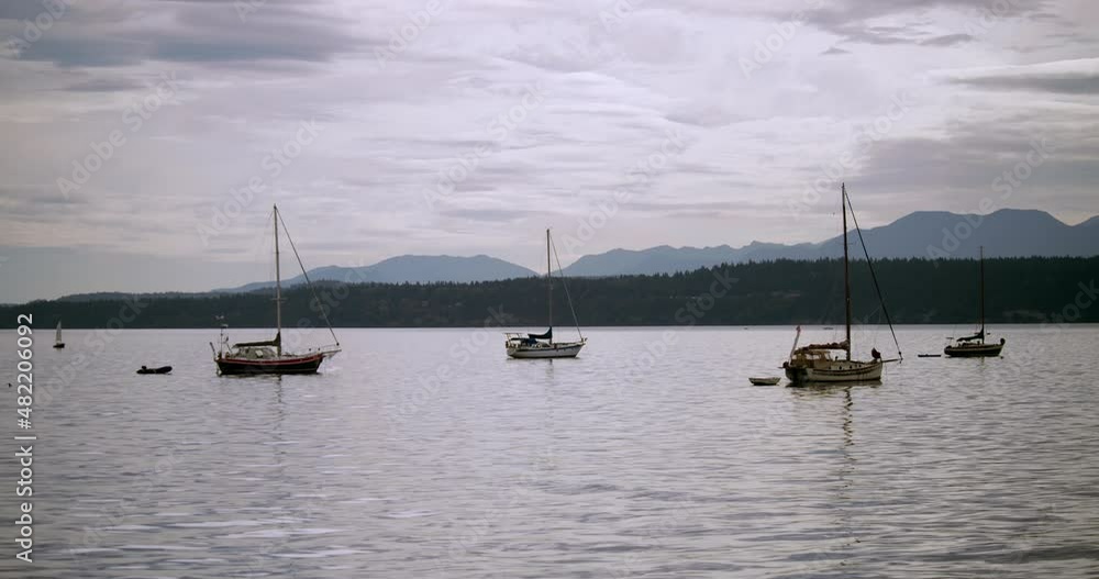 Sailboats floating together on beautiful day Sailboats floating together on beautiful day
