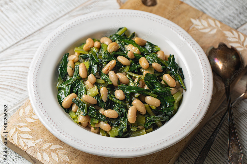 Chicory leaves and Cannellini Beans or Cicoria e fagioli, south Italian vegan salad. Chicory leaves and Cannellini Beans or Cicoria e fagioli, south Italian vegan salad.