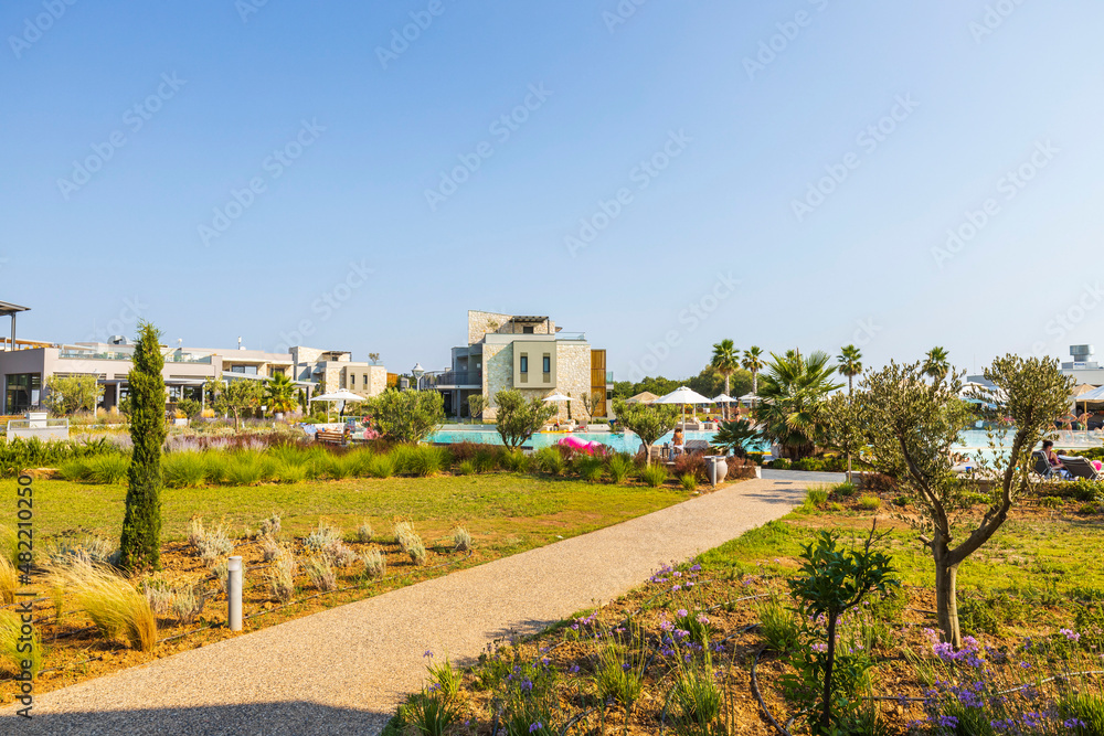Obraz premium Beautiful exterior view of modern resort hotel on blue sky background. Greece.