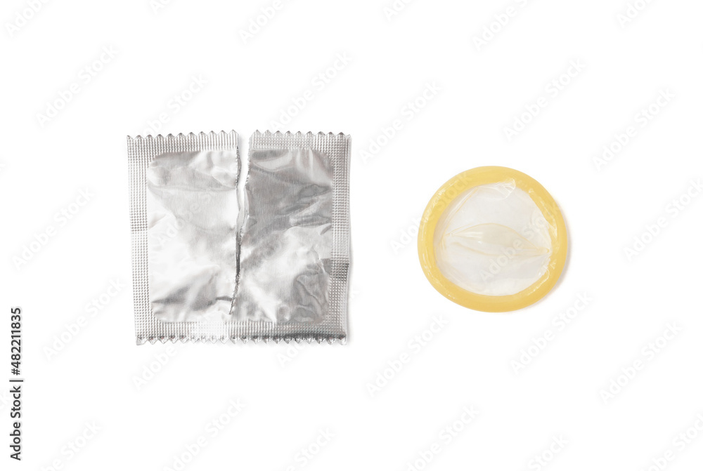 Latex condom and opened wrapper isolated on white background Latex condom and opened wrapper isolated on white background
