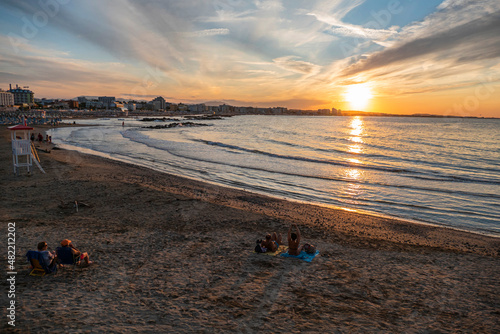 beautiful sunset with the sun setting over the sea in Cattolica photo