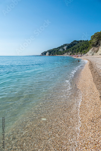 Fototapeta Naklejka Na Ścianę i Meble -  The beautiful beach of San Michele in Sirolo with blue water