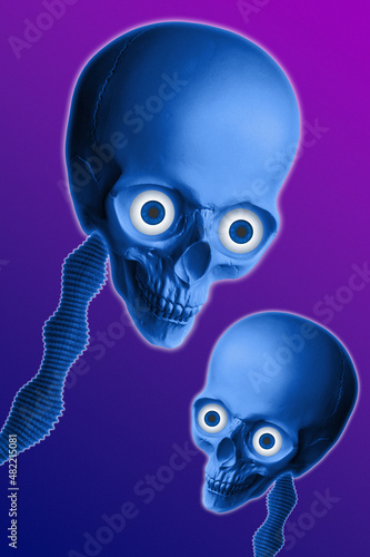 Unusual strange blue alien skull with huge eye sockets on dark purple background. UFO, space, aliens, contact with extraterrestrial civilization. Concept template for poster, fashion, dj, zine art