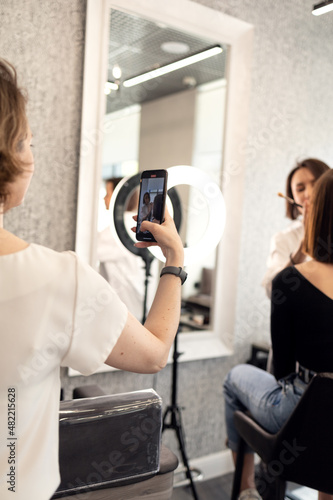 cameraman shoots video in a beauty salon