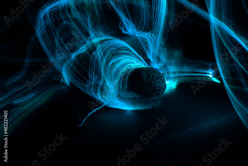 Photography Light painting around a sea turtle with dark background.
