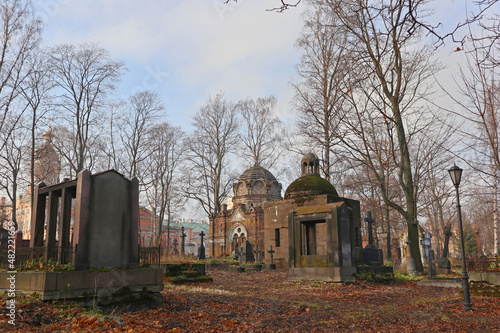 Old crypt and tombs at the Nikolskoe Cemetery at the Alexander Nevsky Lavra in Saint Petersburg, Russia. Burial place was founded in 1861, now is active and freely accessible at the present time.