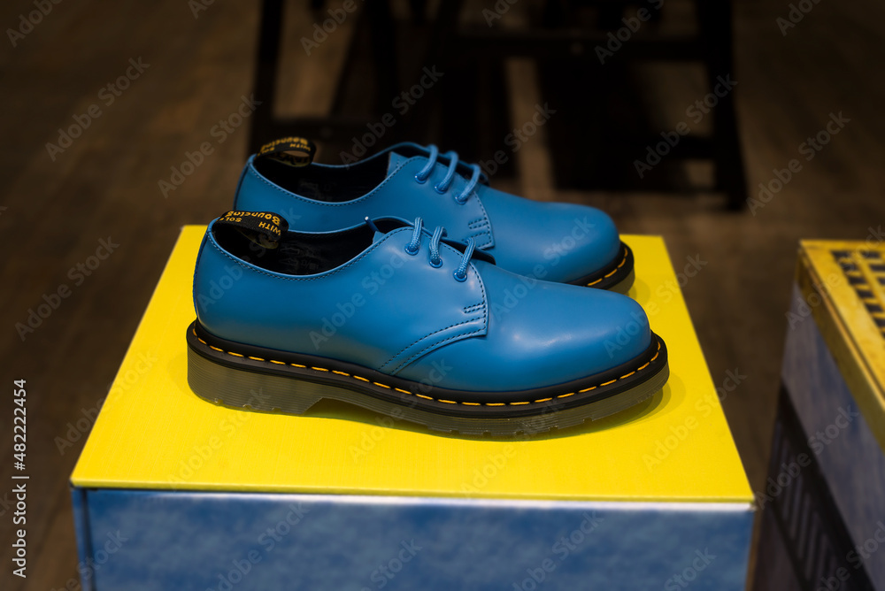 Strasbourg - France - 22 January 2022 - Closeup of blue leather doc martens  boots in a fashion store showroom Stock Photo | Adobe Stock