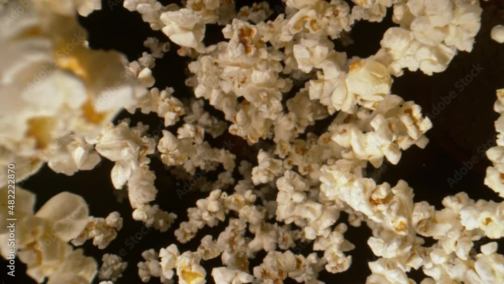 Super Slow Motion Shot of Fresh Fluffy Popcorn Flying Towards the Camera at 1000fps. Super Slow Motion Shot of Fresh Fluffy Popcorn Flying Towards the Camera at 1000fps.