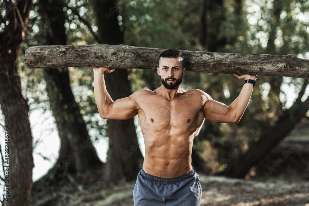Man Doing Training Outdoor With Timber Man Doing Training Outdoor With Timber