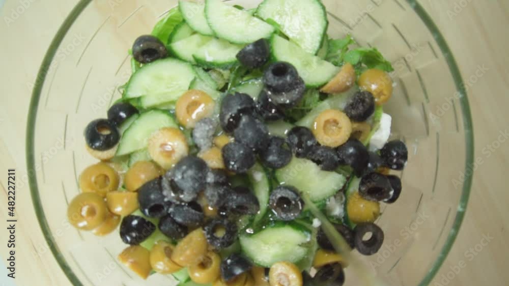 Greek salad. Seasoning with olive oil. Healthy food Greek salad. Seasoning with olive oil. Healthy food
