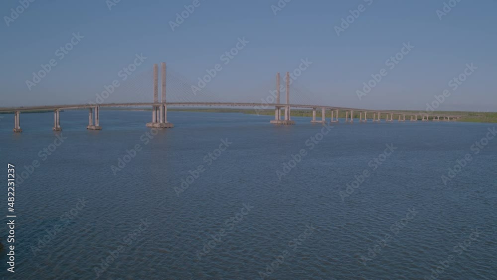 aerial view of drone taking off and approaching João Alves bridge over Sergipe river in Aracaju aerial view of drone taking off and approaching João Alves bridge over Sergipe river in Aracaju