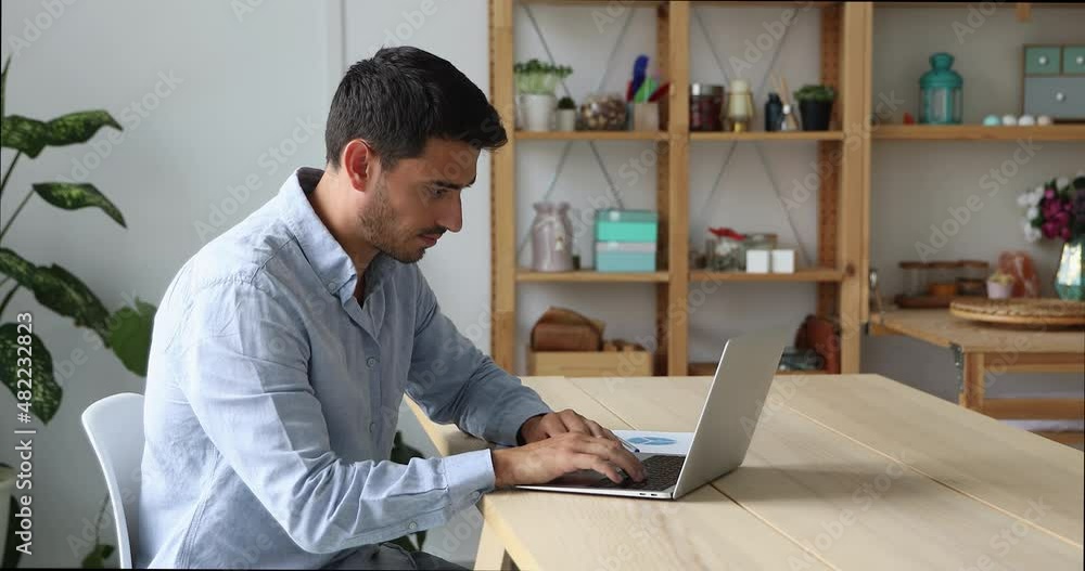 Hispanic thoughtful businessman sit at desk text on laptop, check corporate e-mail, write answer, lead business correspondence with client, solve issues use computer, working on online project concept Hispanic thoughtful businessman sit at desk text on laptop, check corporate e-mail, write answer, lead business correspondence with client, solve issues use computer, working on online project concept