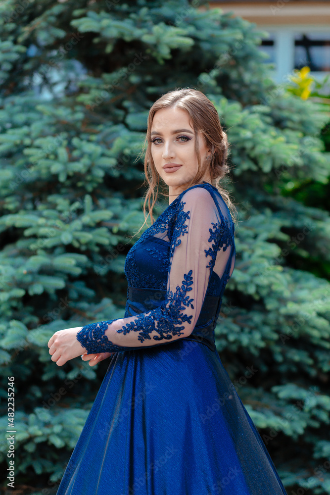 Beautiful girl in glamorous ultramarine dress. Ready for her prom night. Beautiful girl in glamorous ultramarine dress. Ready for her prom night.