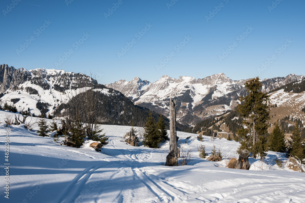 Scenic view of snowcapped swiss mountains with blue sky,Jaunpass,Switzerland