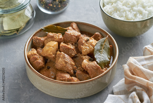 traditional filipino food pork adobo garlic vinegar soy sauce steamed rice bay leaves mix of pepper photo