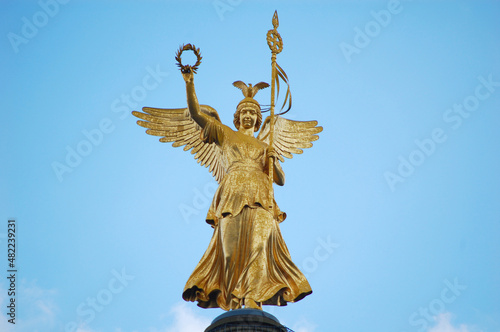 Golden Statue on the top of the Victory Column Berlin at the Grosser Stern Square.