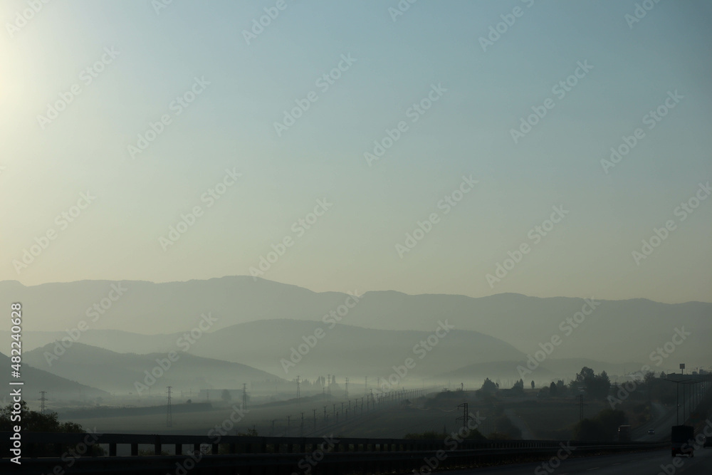 morning mist over the highway in the mountains