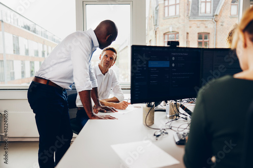 Businessmen working at a computer