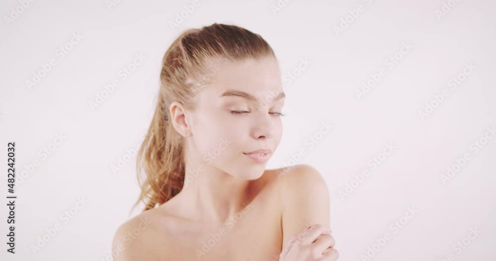 Beautiful young girl with fresh and natural skin looking into the camera and smiling Beautiful young girl with fresh and natural skin looking into the camera and smiling