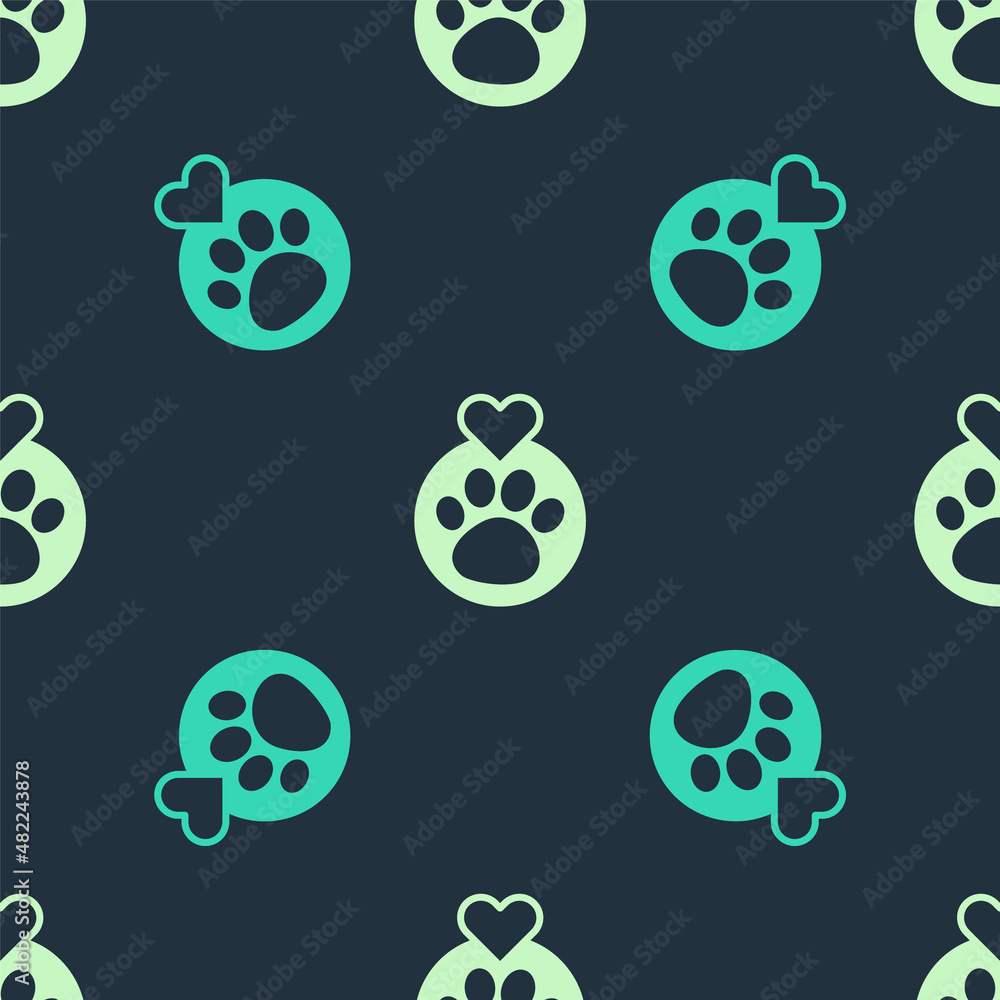 Green and beige Heart with animals footprint icon isolated seamless pattern on blue background. Pet paw in heart. Love to the animals. Vector