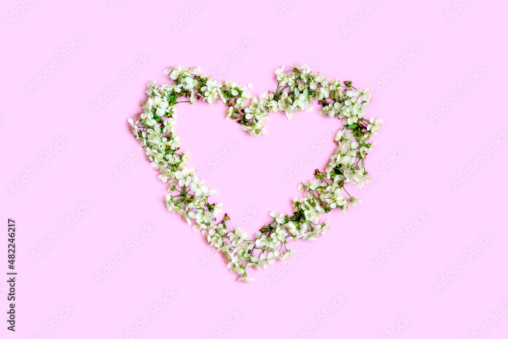Heart shape made of flowers.Valentine's Day Greeting Card.Top view. Space for text.