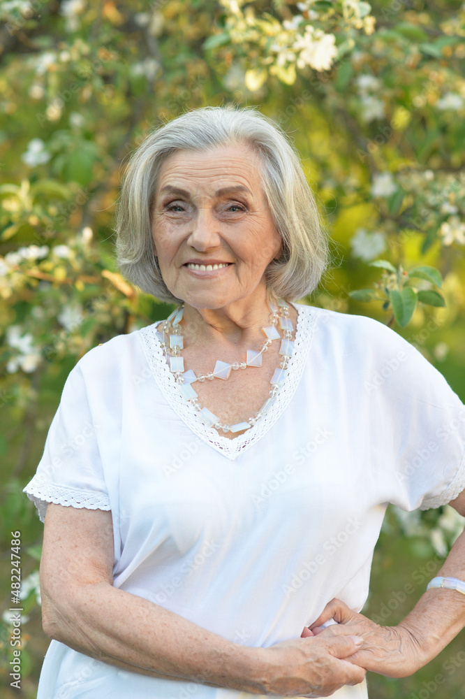 Portrait of senior beautiful woman in spring park