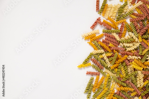 raw trottole tricolore wheat italian food macro on white background photo