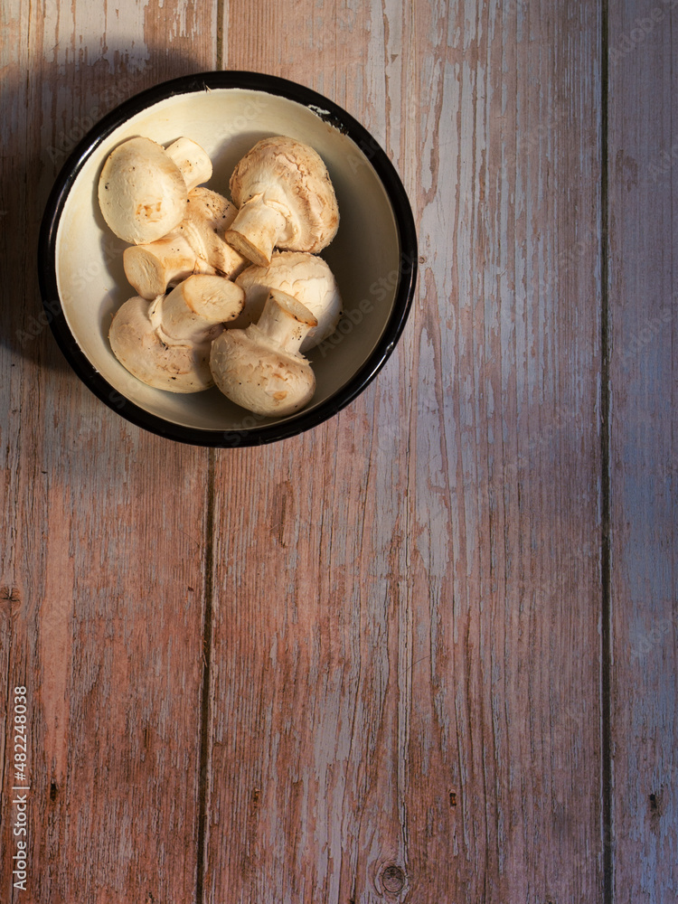 bowl with mushrooms on wooden top and space for writing bowl with mushrooms on wooden top and space for writing