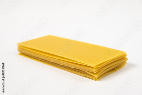 raw pasta for lasagna on white background