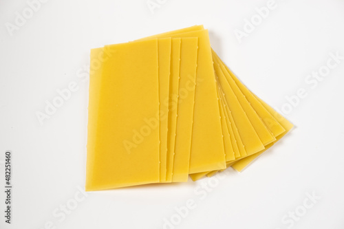 raw pasta for lasagna on white background