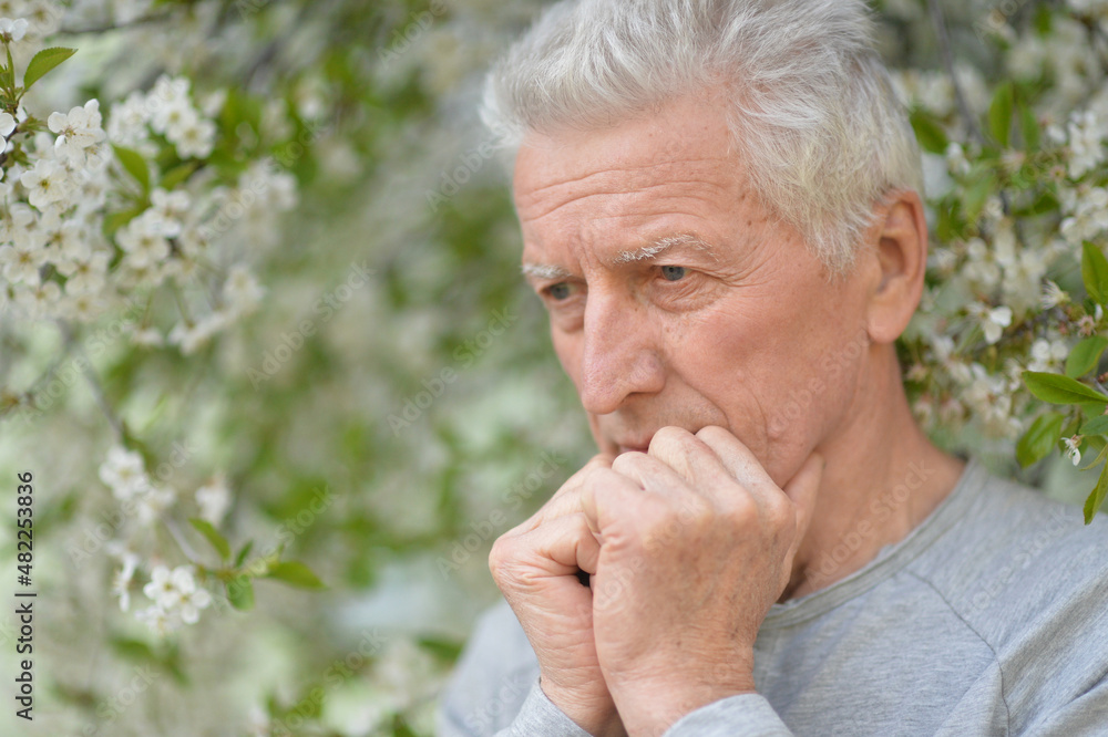 Senior man thinking about something outdoor Senior man thinking about something outdoor