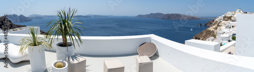 Panoramic view of Oia town in Santorini island with old whitewashed houses, Greece Greek landscape on a sunny day